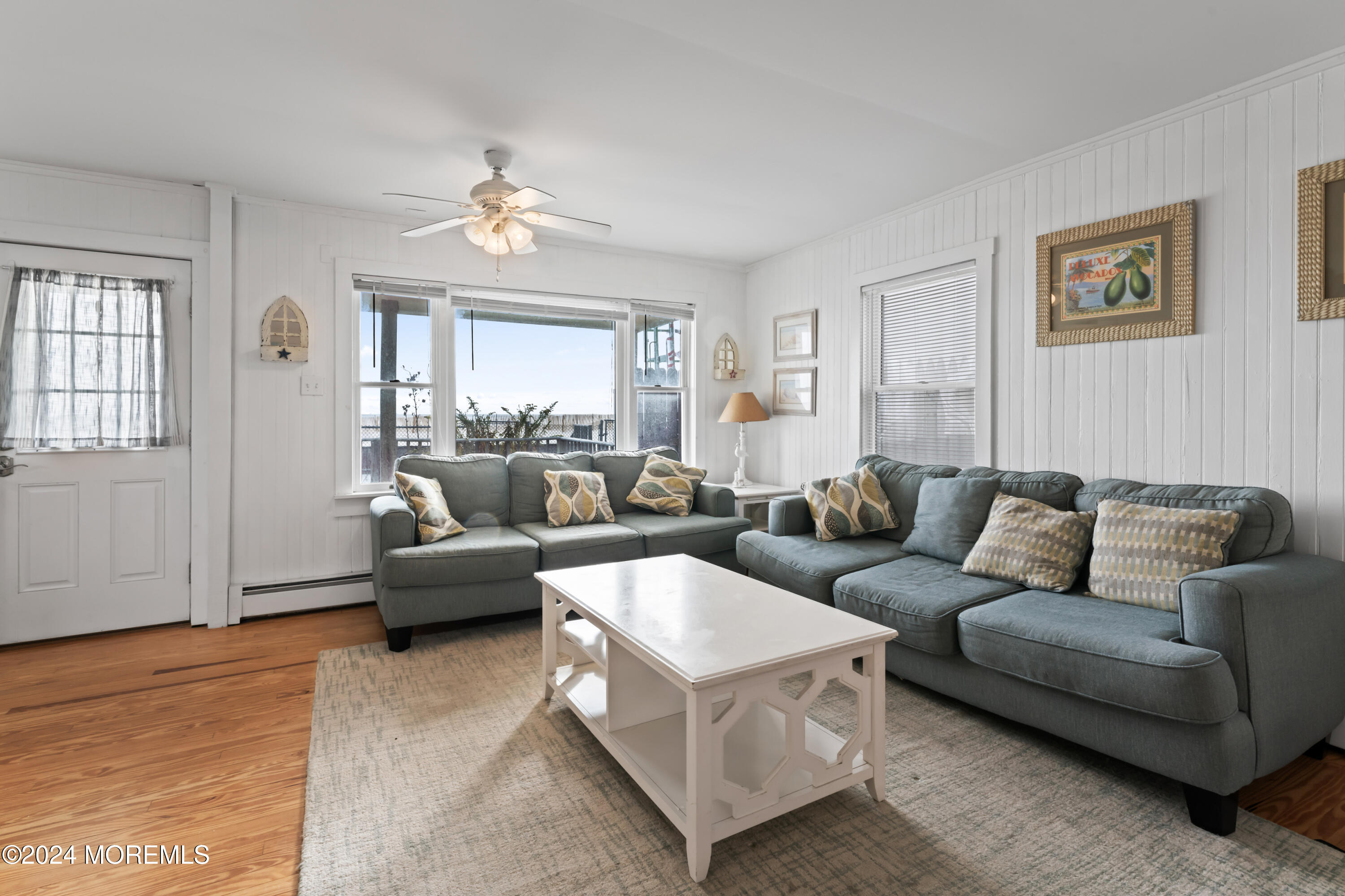 255 Boardwalk Point Pleasant Beach, NJ 08742 - Photo 10 of 34 a living room with furniture and a large window