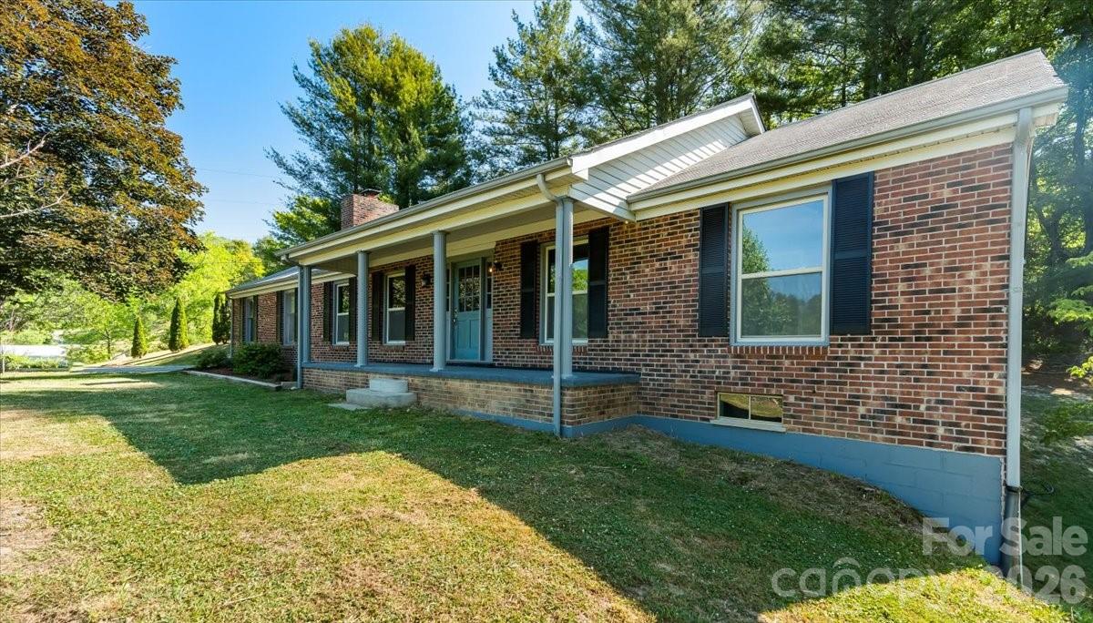 14 Jack Sullins Road Spruce Pine, NC 28777 - Photo 1 of 37 a view of brick house with a yard