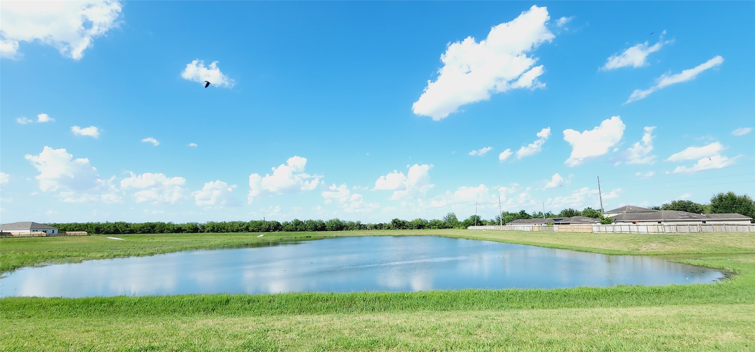 6339 Highland Trl Drive Richmond, TX 77469 - Photo 2 of 28 a view of a lake and a yard
