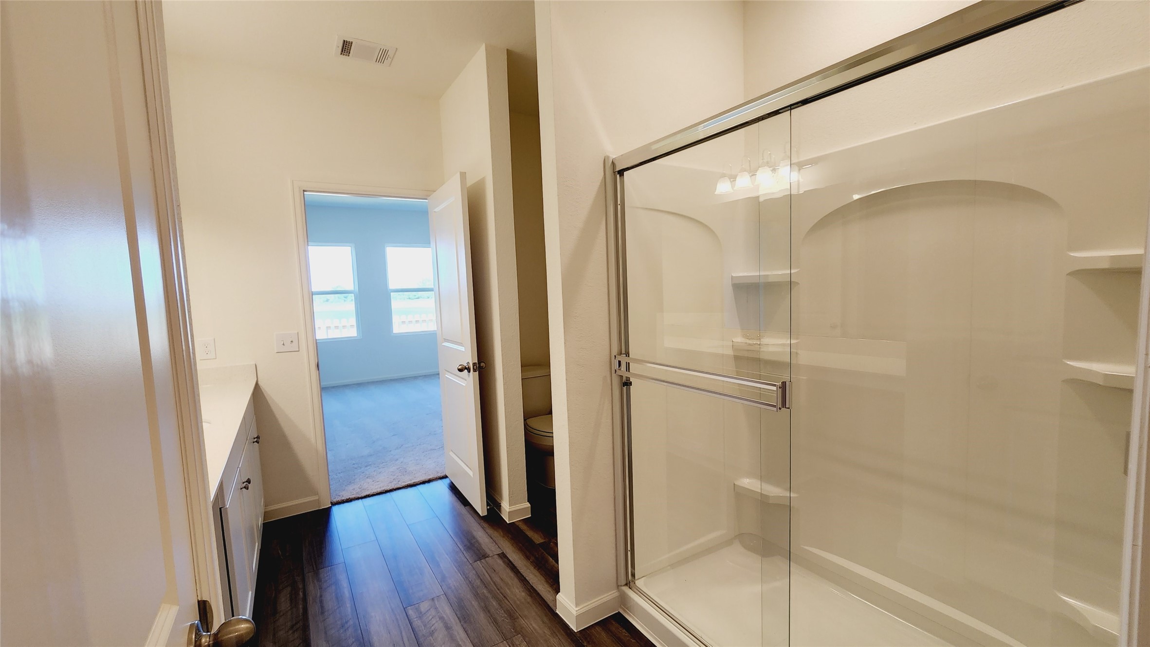6339 Highland Trl Drive Richmond, TX 77469 - Photo 23 of 28 a bathroom with a glass shower door