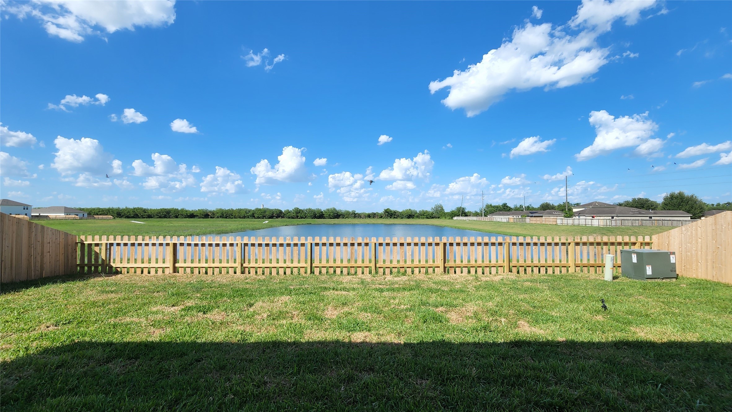 6339 Highland Trl Drive Richmond, TX 77469 - Photo 27 of 28 a view of a lake with a big yard