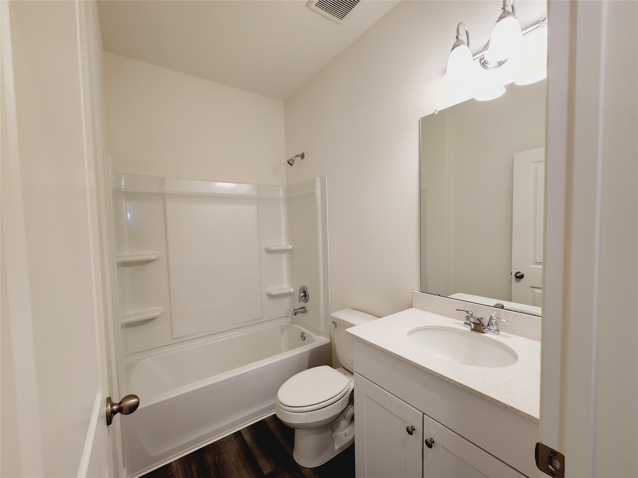 6339 Highland Trl Drive Richmond, TX 77469 - Photo 7 of 28 a bathroom with a sink a toilet a mirror and shower