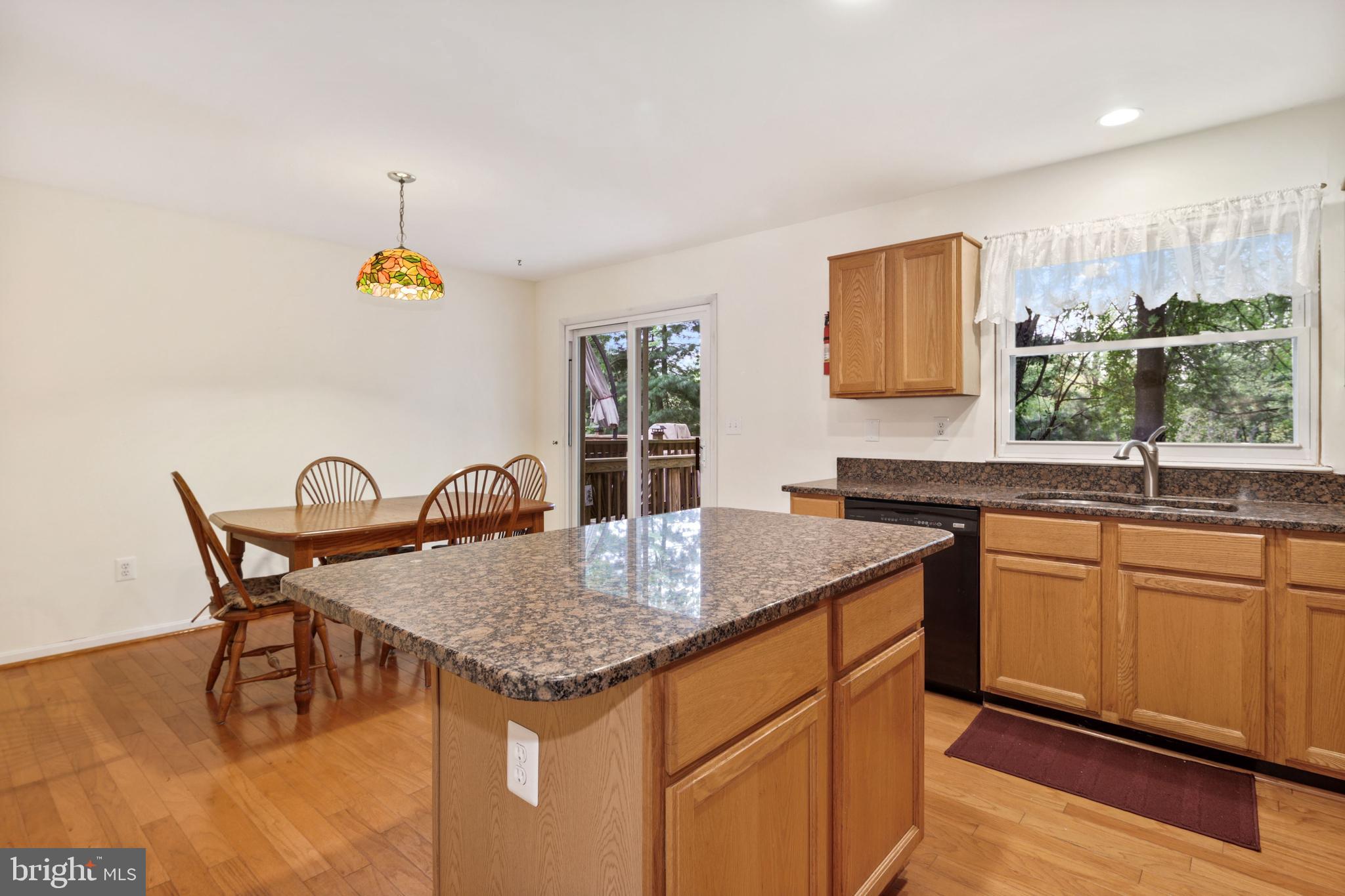 10942 Baskerville Road Reisterstown, MD 21136 - Photo 8 of 27 Kitchen adjoins dining area and walks out to deck
