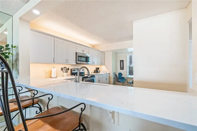 a living room with furniture and flat screen tv