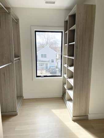 21 Tocci Path Newton, MA 02459 - Photo 16 of 24 a view of wooden floor and windows in a room