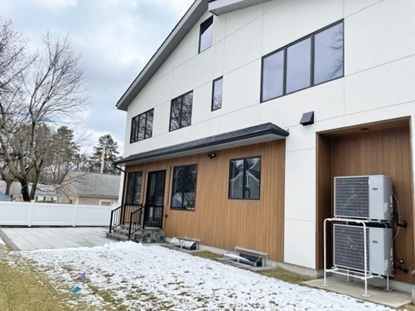 21 Tocci Path Newton, MA 02459 - Photo 3 of 24 a view of a house with snow on the wall