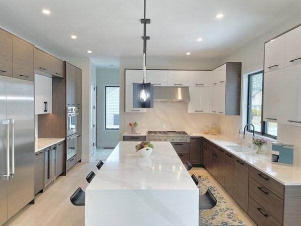21 Tocci Path Newton, MA 02459 - Photo 5 of 24 a kitchen with stainless steel appliances a sink stove and refrigerator