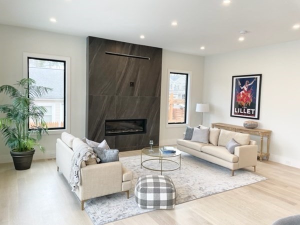 21 Tocci Path Newton, MA 02459 - Photo 6 of 24 a living room with furniture potted plant and a window
