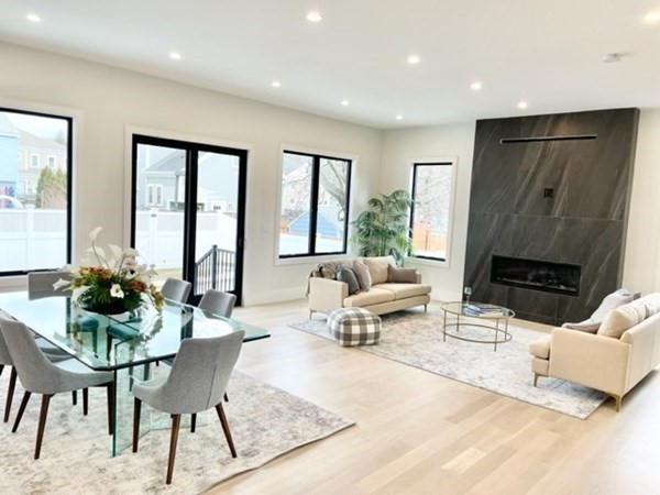 21 Tocci Path Newton, MA 02459 - Photo 7 of 24 a living room with furniture and a fireplace