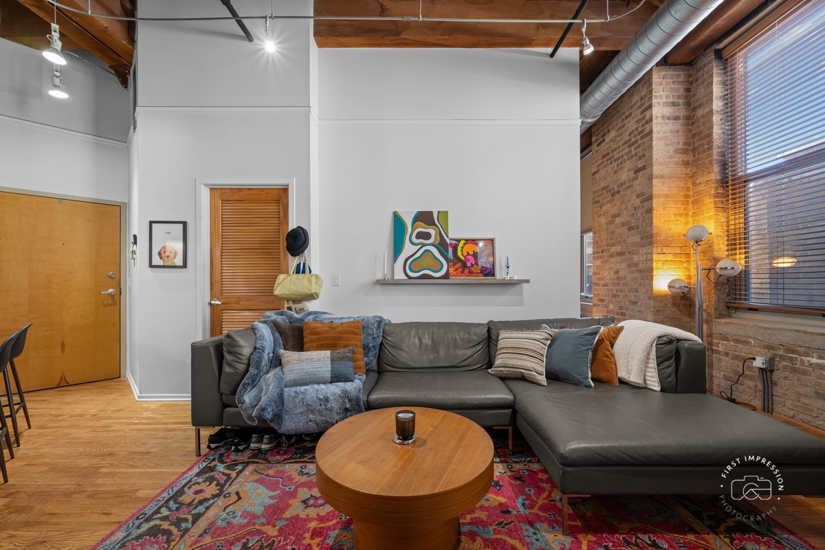 1500 West Monroe Street, Unit 409 Chicago, IL 60607 - Photo 11 of 20 a living room with furniture and a rug