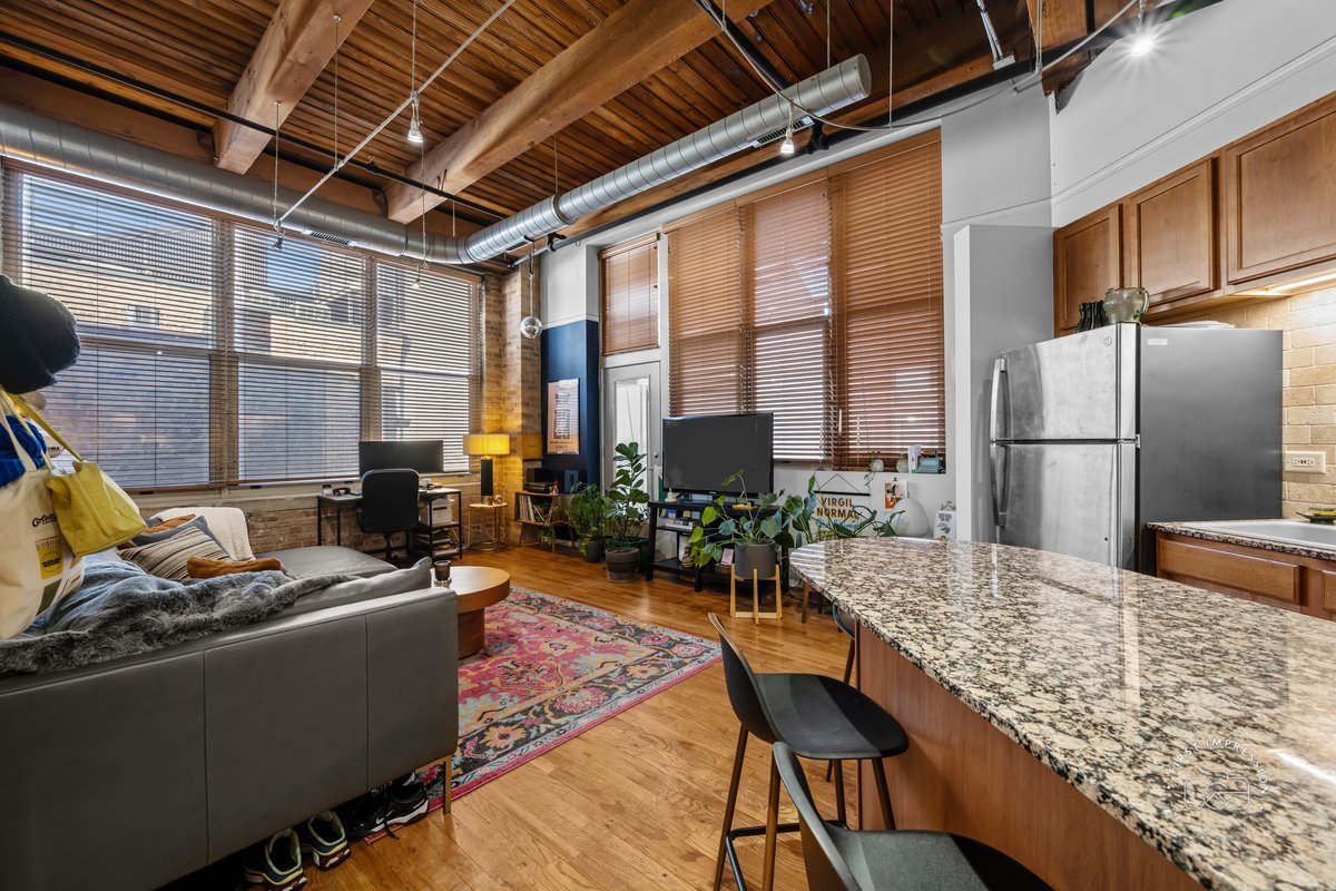 1500 West Monroe Street, Unit 409 Chicago, IL 60607 - Photo 5 of 20 a living room with large window