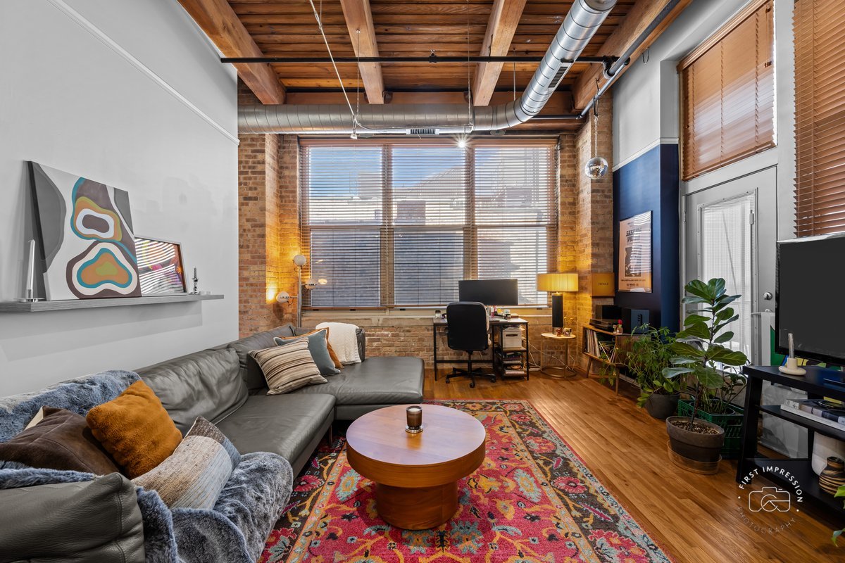 1500 West Monroe Street, Unit 409 Chicago, IL 60607 - Photo 9 of 20 a living room with furniture and a flat screen tv