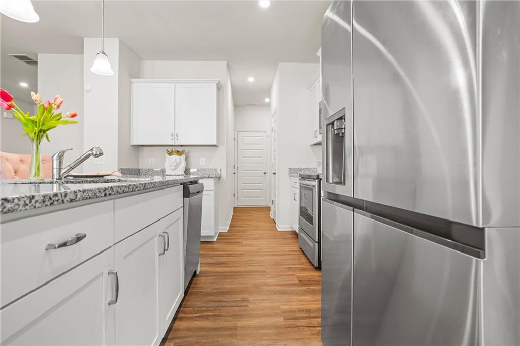 10 Kane Drive Jasper, GA 30143 - Photo 11 of 24 a view of a kitchen with kitchen island white cabinets and stainless steel appliances