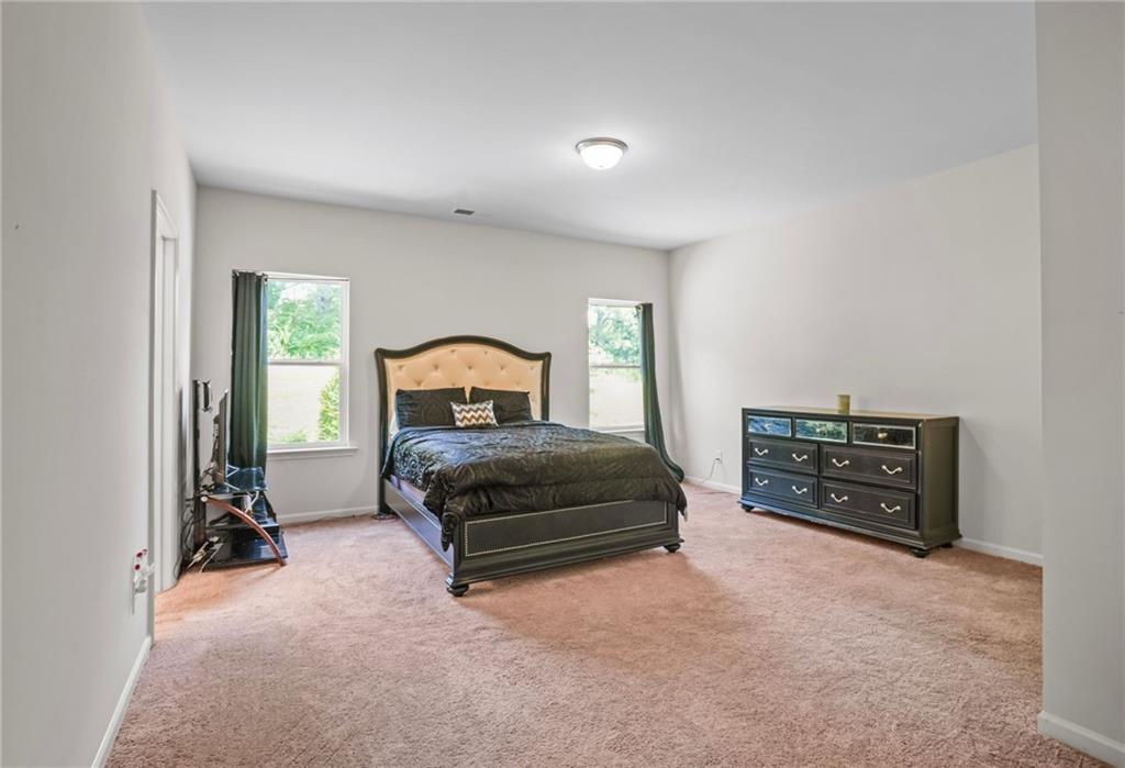 10 Kane Drive Jasper, GA 30143 - Photo 14 of 24 a bedroom with a bed and a car