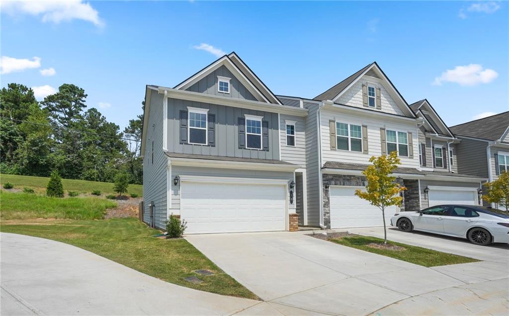 10 Kane Drive Jasper, GA 30143 - Photo 3 of 24 a front view of a house with a garden and trees