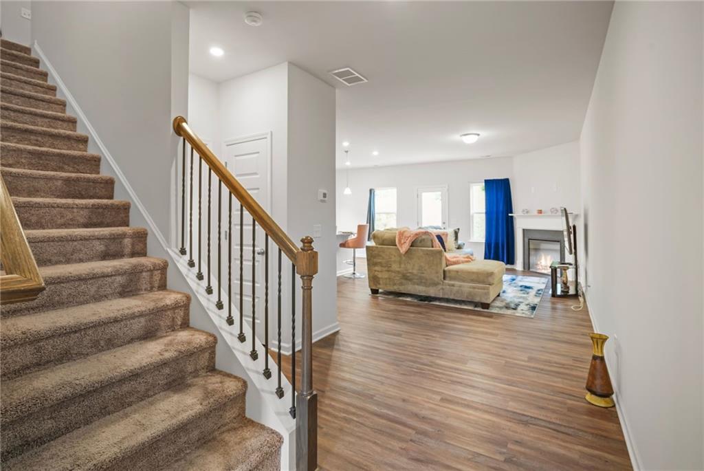 10 Kane Drive Jasper, GA 30143 - Photo 5 of 24 a living room with furniture and a dining table with wooden floor
