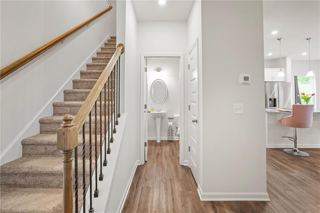 10 Kane Drive Jasper, GA 30143 - Photo 6 of 24 a view of a hallway with wooden floor and staircase