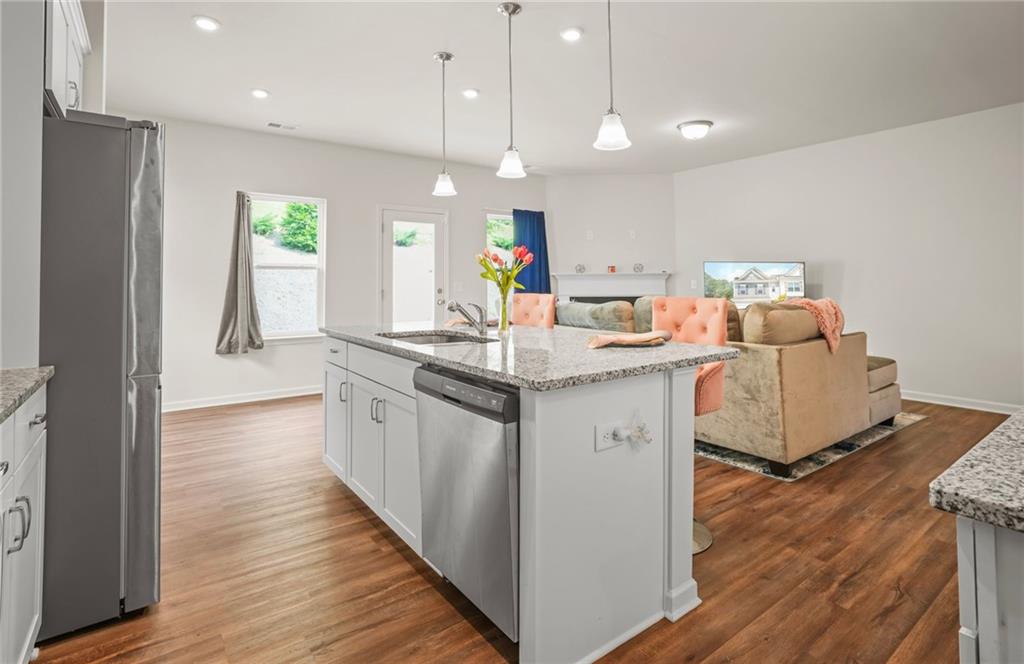 10 Kane Drive Jasper, GA 30143 - Photo 9 of 24 a kitchen with a sink stove and wooden floor