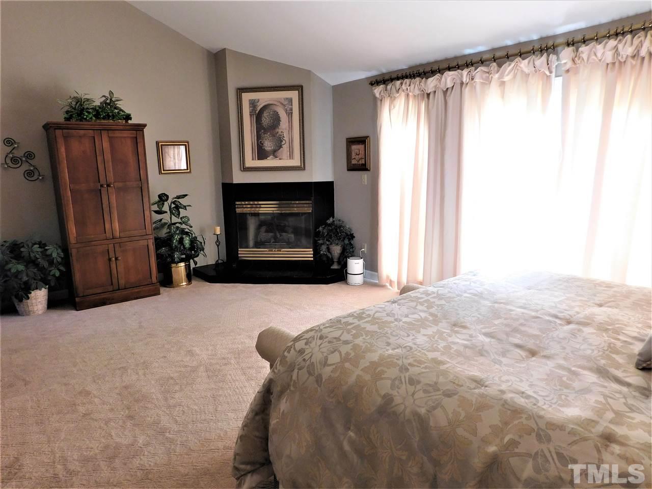 1308 Bascomb Drive Raleigh, NC 27614 - Photo 14 of 25 Second Floor Master with Gas Log Fireplace and Balcony! Master Bath w/ Whirlpool Tub,Walk In Shower and Huge Closets!
