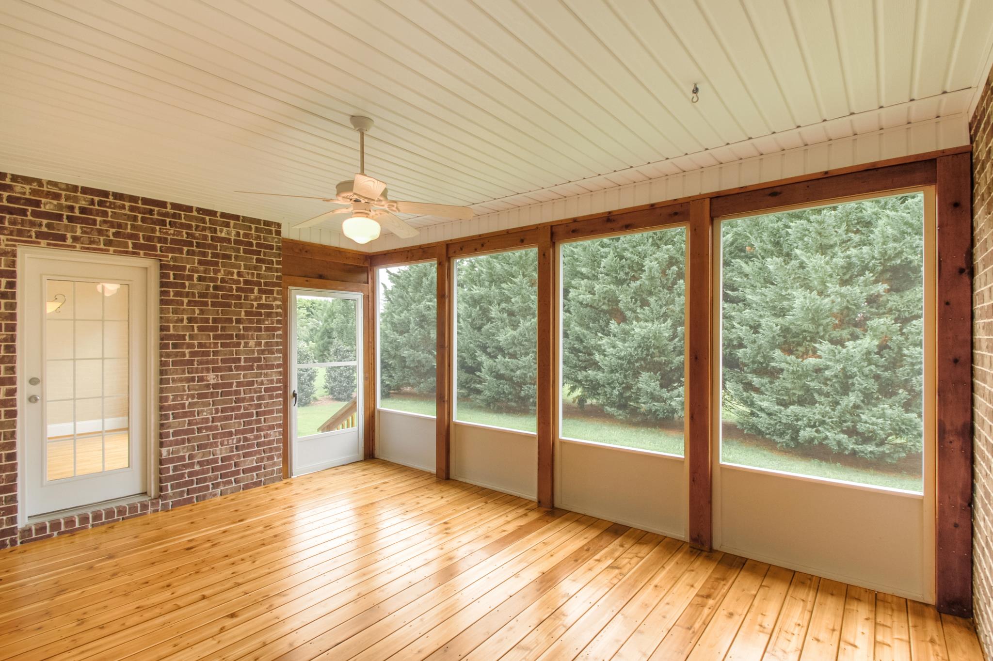 1631 Fair House Road Spring Hill, TN 37174 - Photo 16 of 29 a view of an empty room with wooden floor and a window