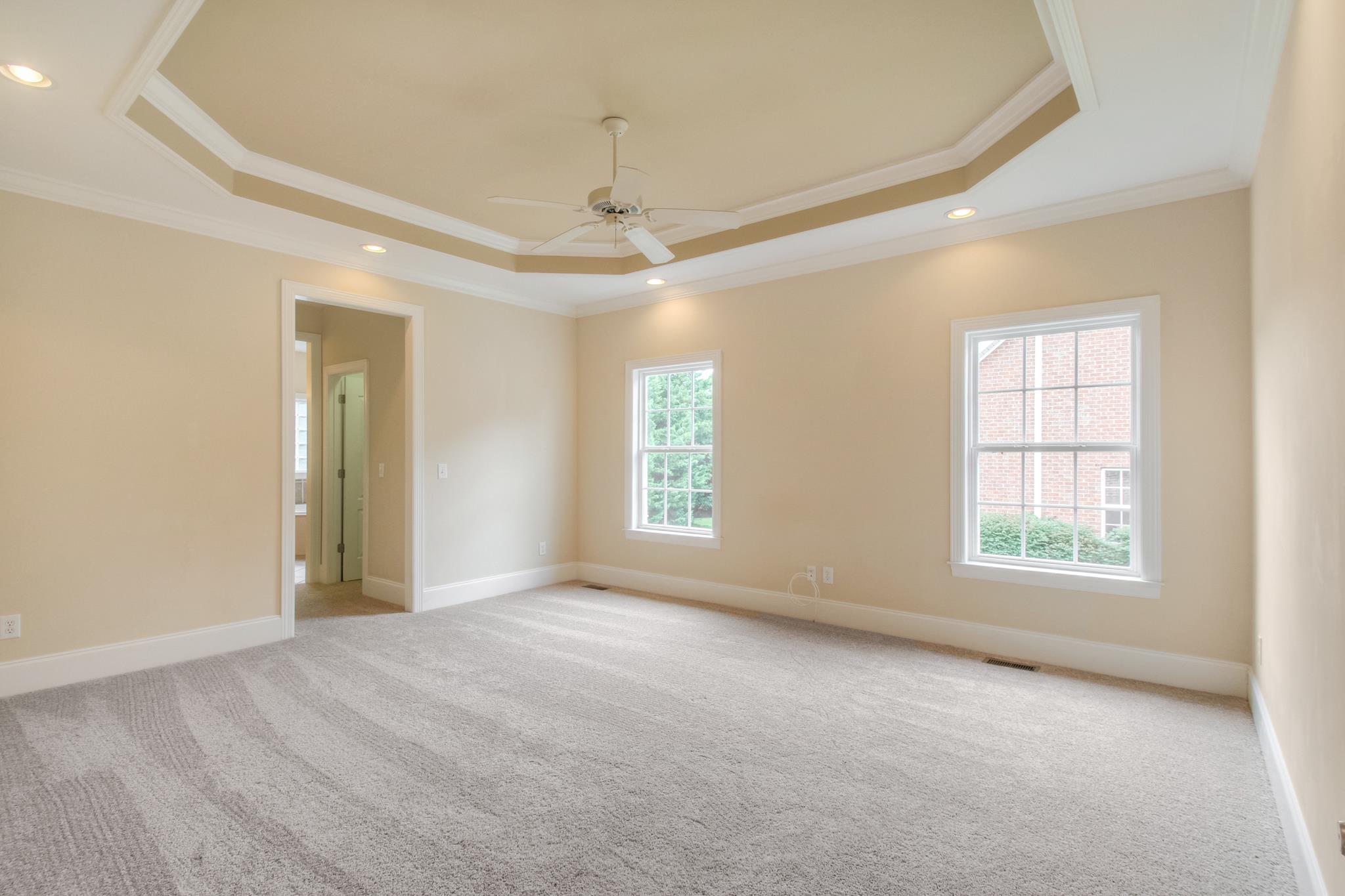 1631 Fair House Road Spring Hill, TN 37174 - Photo 17 of 29 an empty room with chandelier fan and windows