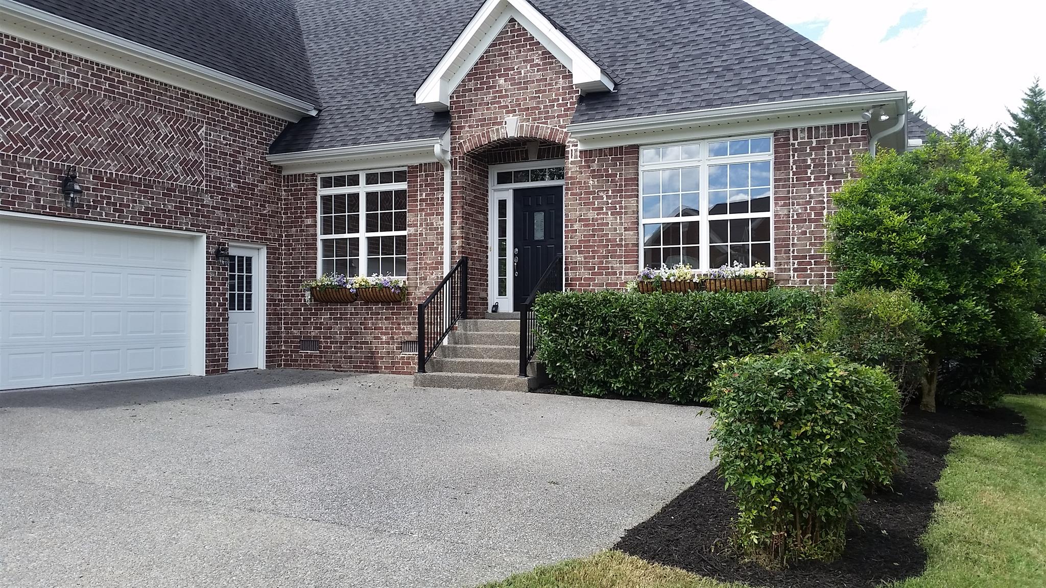 1631 Fair House Road Spring Hill, TN 37174 - Photo 3 of 29 front view of a house with a garden