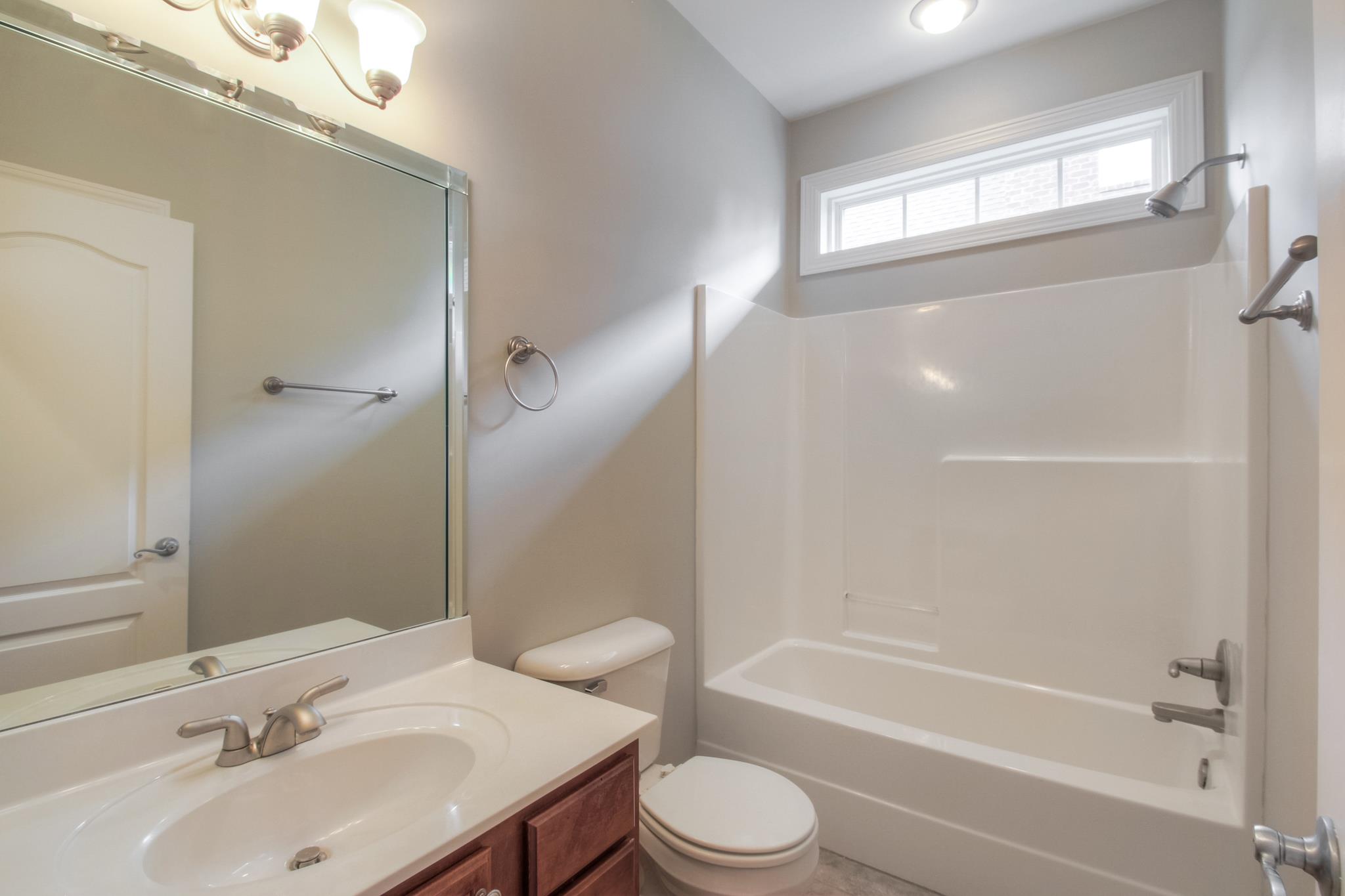 1631 Fair House Road Spring Hill, TN 37174 - Photo 22 of 29 a bathroom with a sink toilet and shower