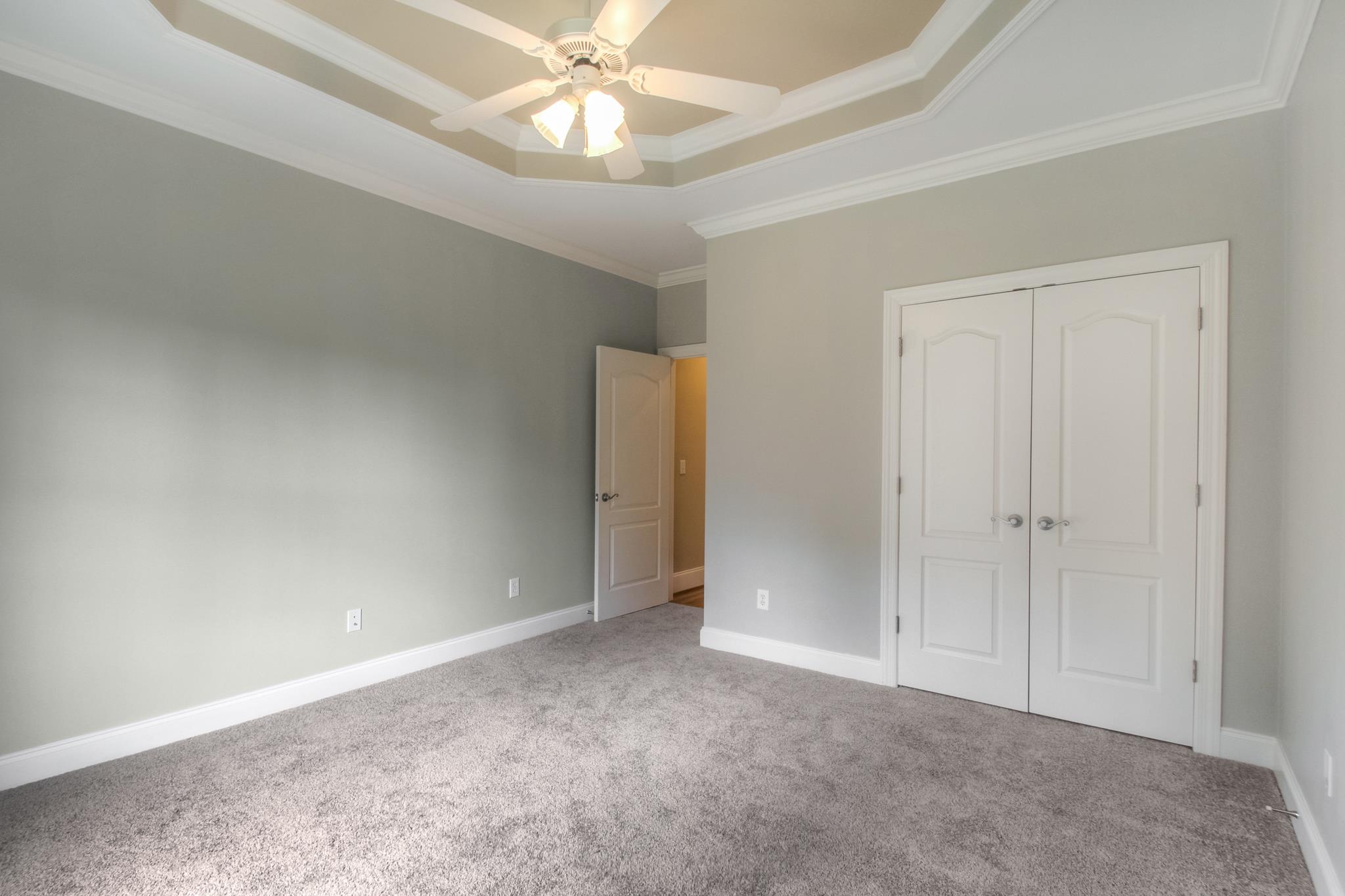 1631 Fair House Road Spring Hill, TN 37174 - Photo 24 of 29 an empty room with a ceiling fan and a window