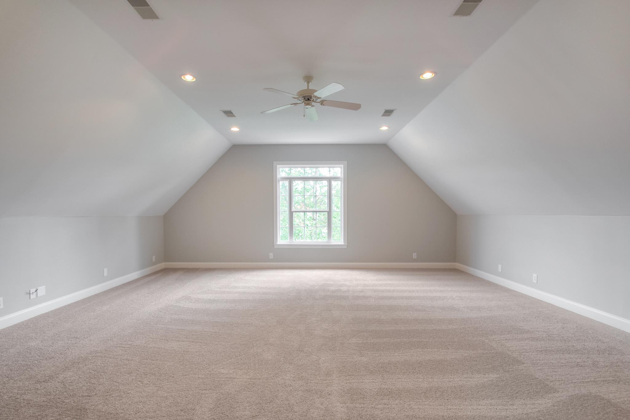 1631 Fair House Road Spring Hill, TN 37174 - Photo 26 of 29 en empty room with windows and ceiling fan