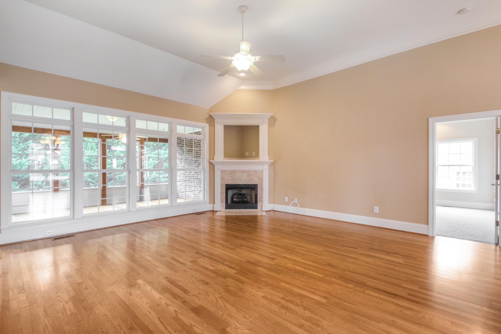1631 Fair House Road Spring Hill, TN 37174 - Photo 10 of 29 a view of an empty room with window and wooden floor