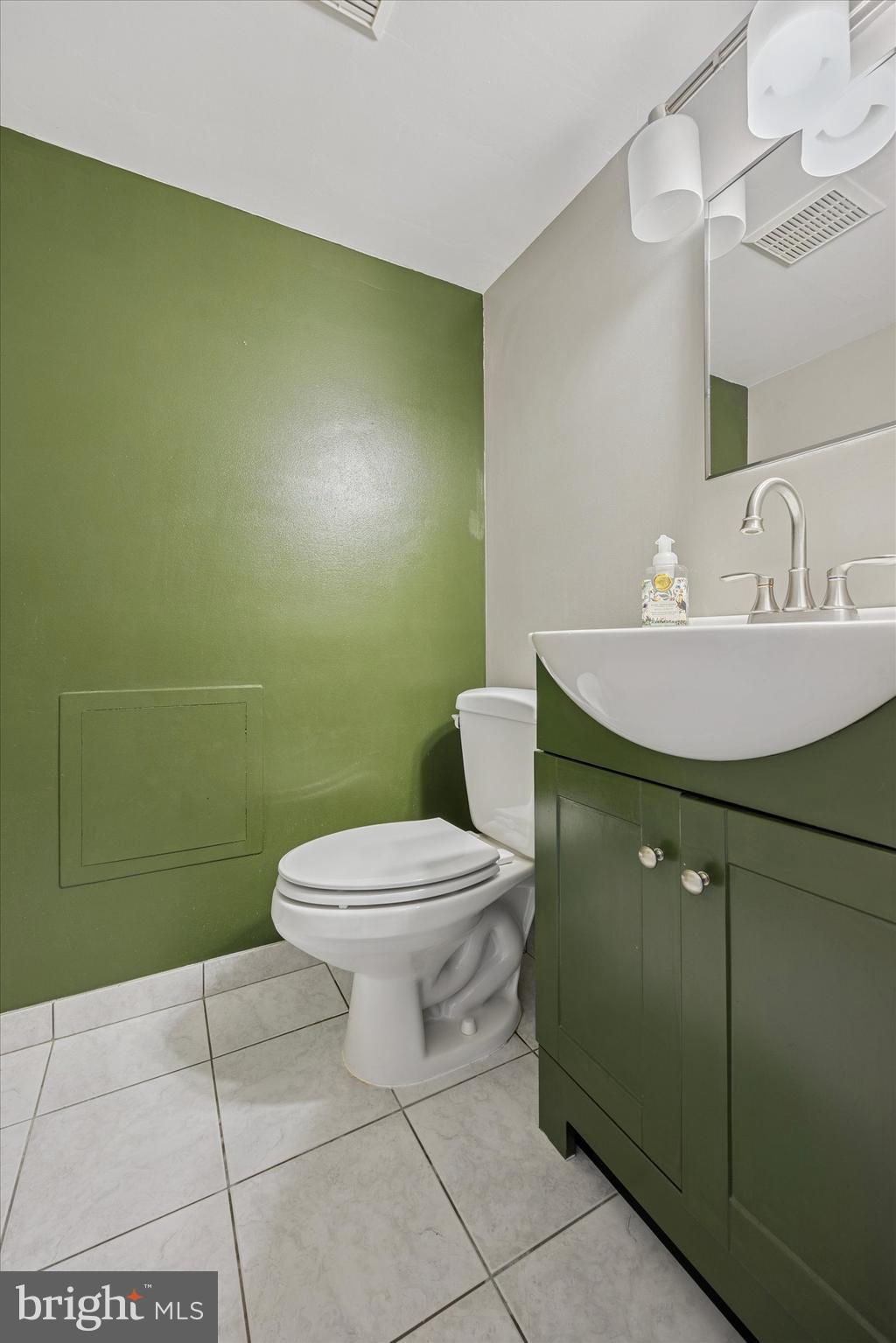 539 Overlook Road Philadelphia, PA 19128 - Photo 21 of 25 a bathroom with a toilet sink and mirror