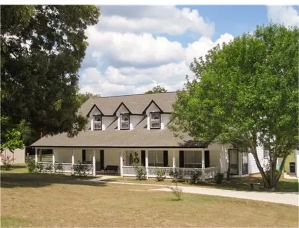 a kitchen with sink cabinets and window