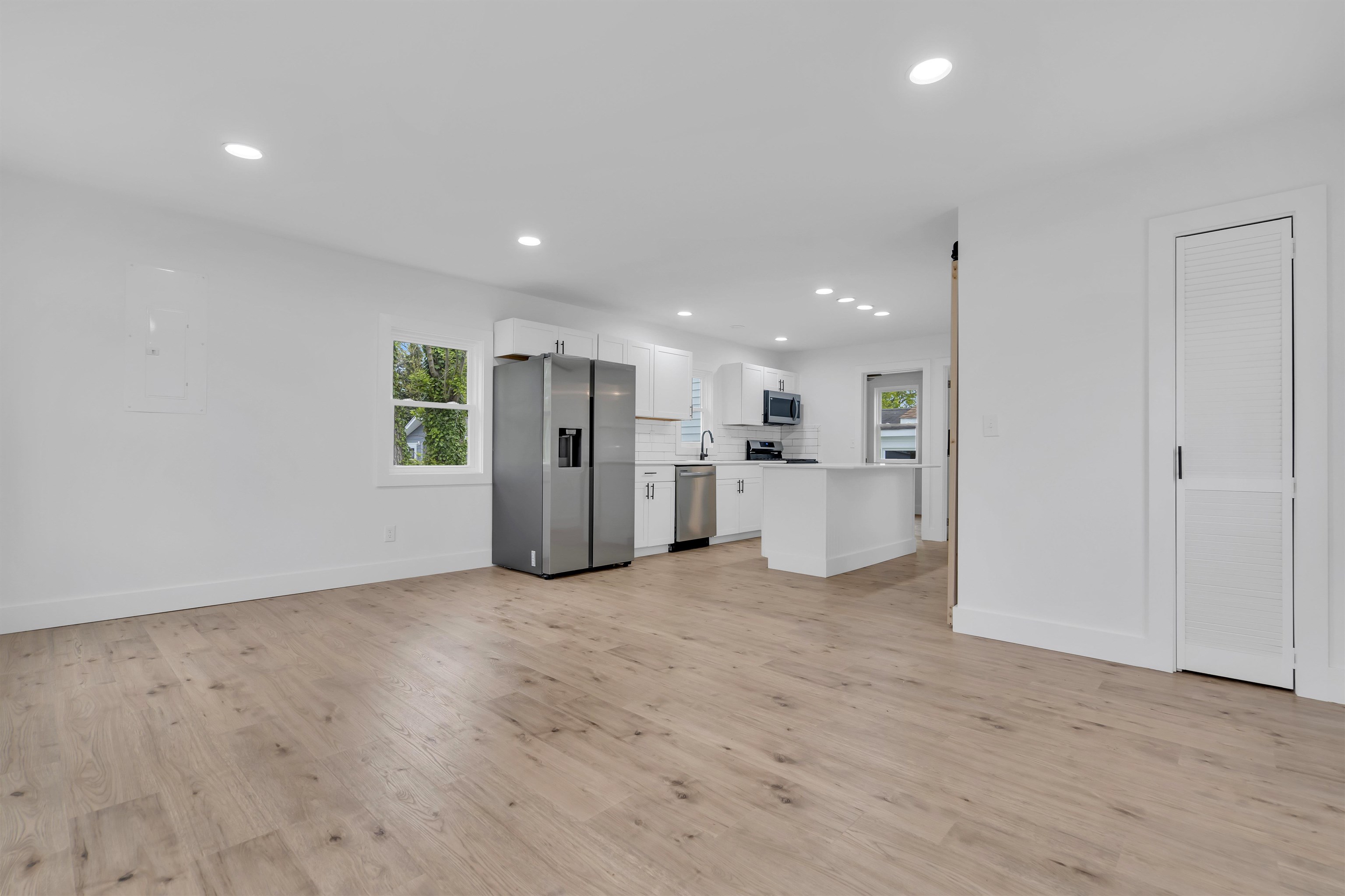 539 Seashore Road Erma, NJ 08204 - Photo 2 of 18 a view of a kitchen with a refrigerator and a microwave