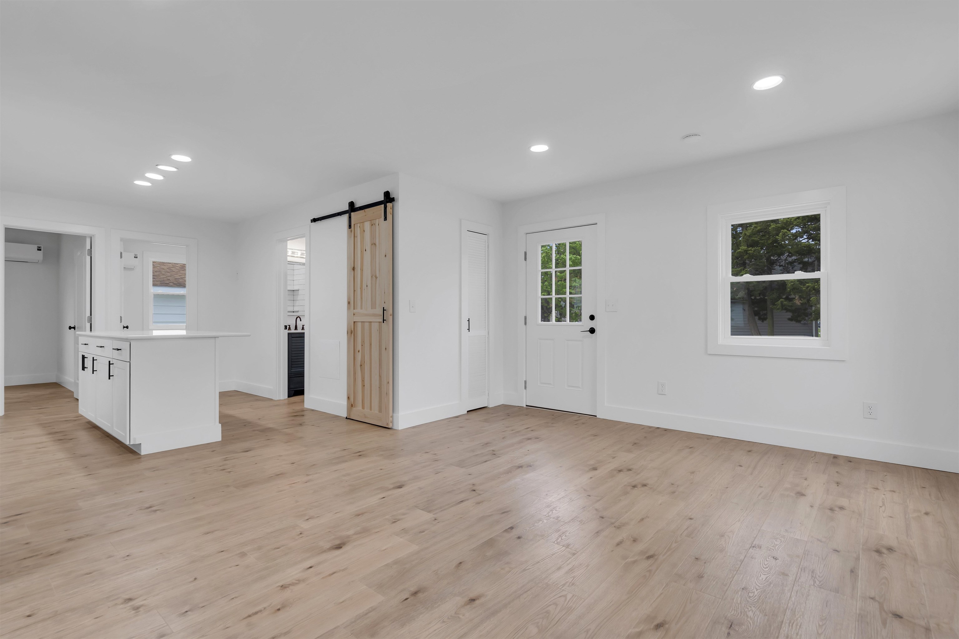 539 Seashore Road Erma, NJ 08204 - Photo 3 of 18 an empty room with wooden floor and windows