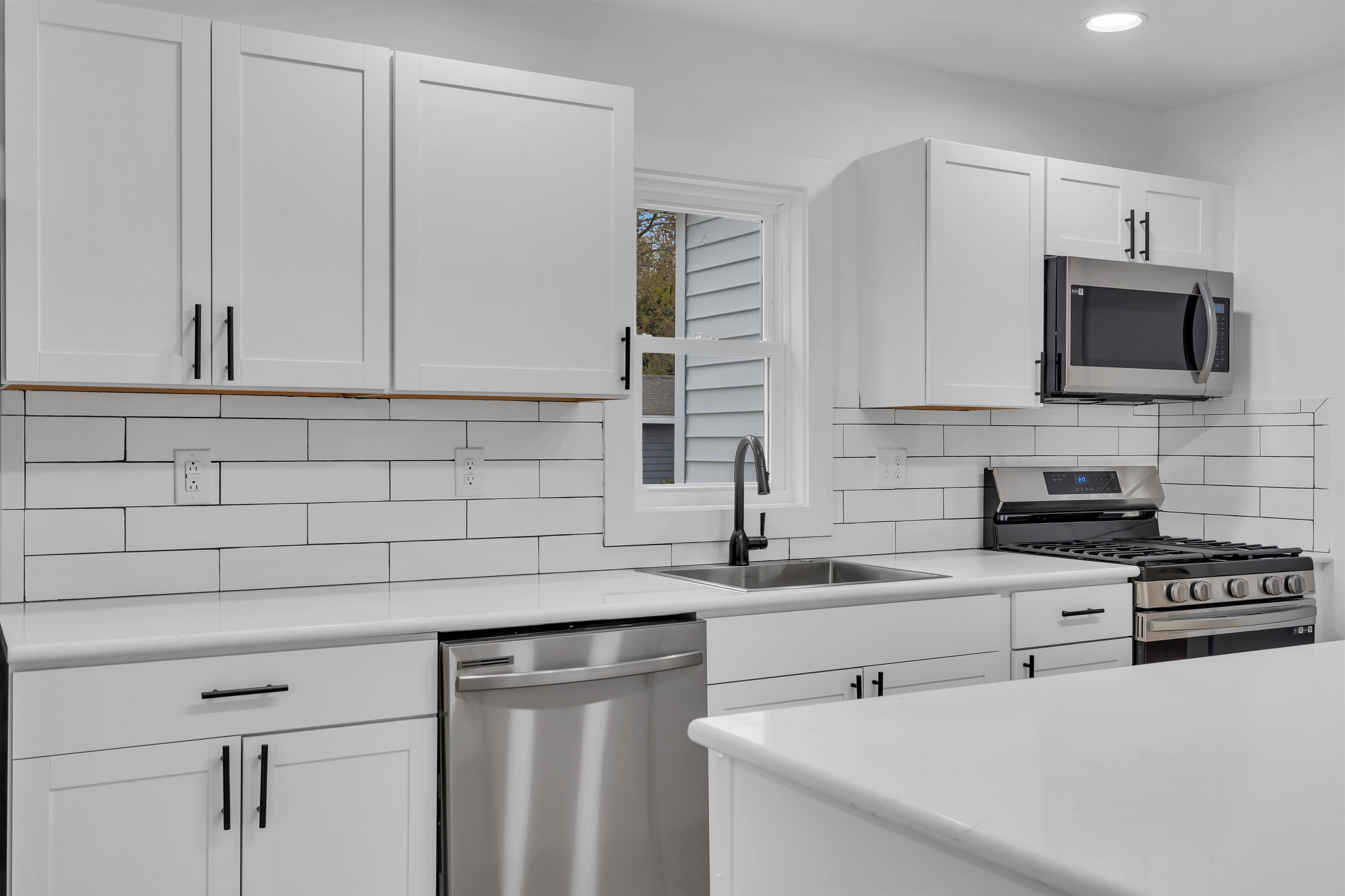 539 Seashore Road Erma, NJ 08204 - Photo 6 of 18 a kitchen with stainless steel appliances a sink a stove and a microwave
