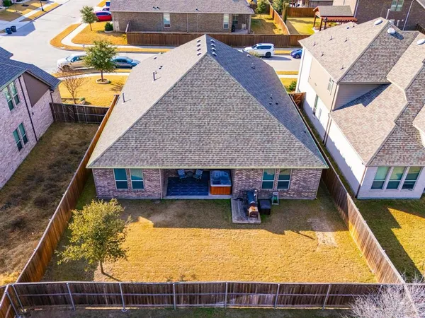an aerial view of a house with swimming pool
