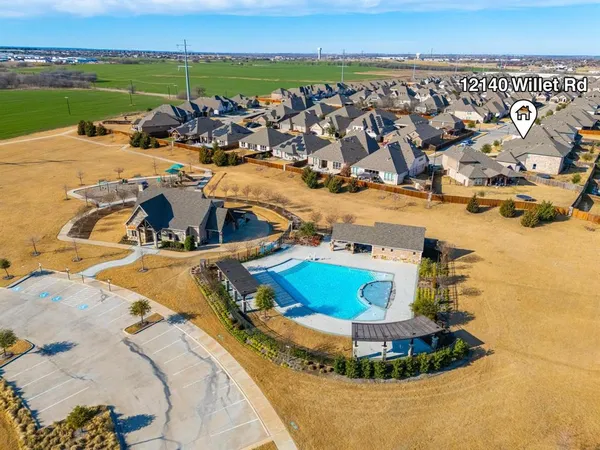 a view of a swimming pool with an ocean and trees