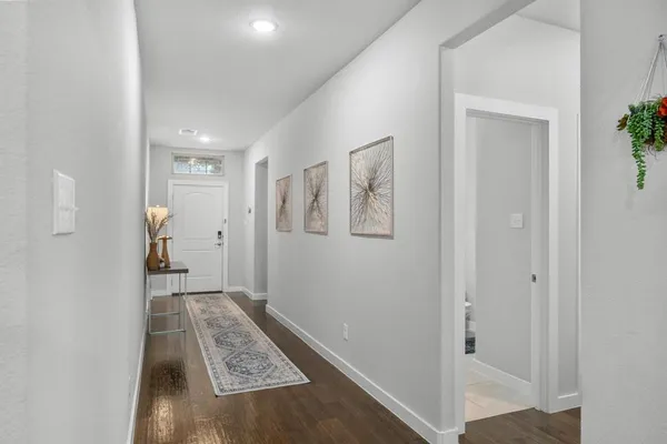 a view of room with window and hallway