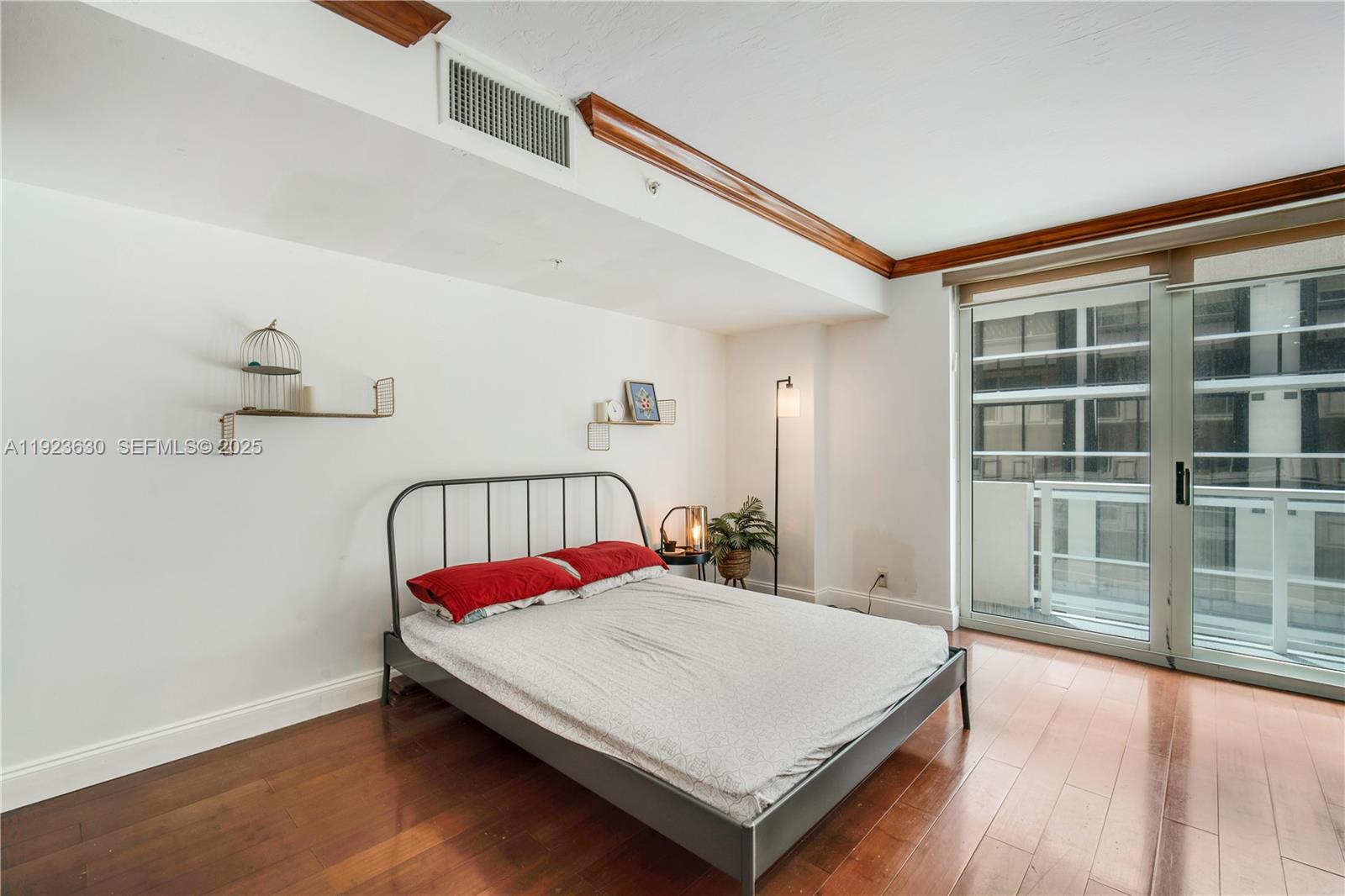 9499 Collins Avenue, Unit 1005 Surfside, FL 33154 - Photo 14 of 35 a bedroom with a bed and window