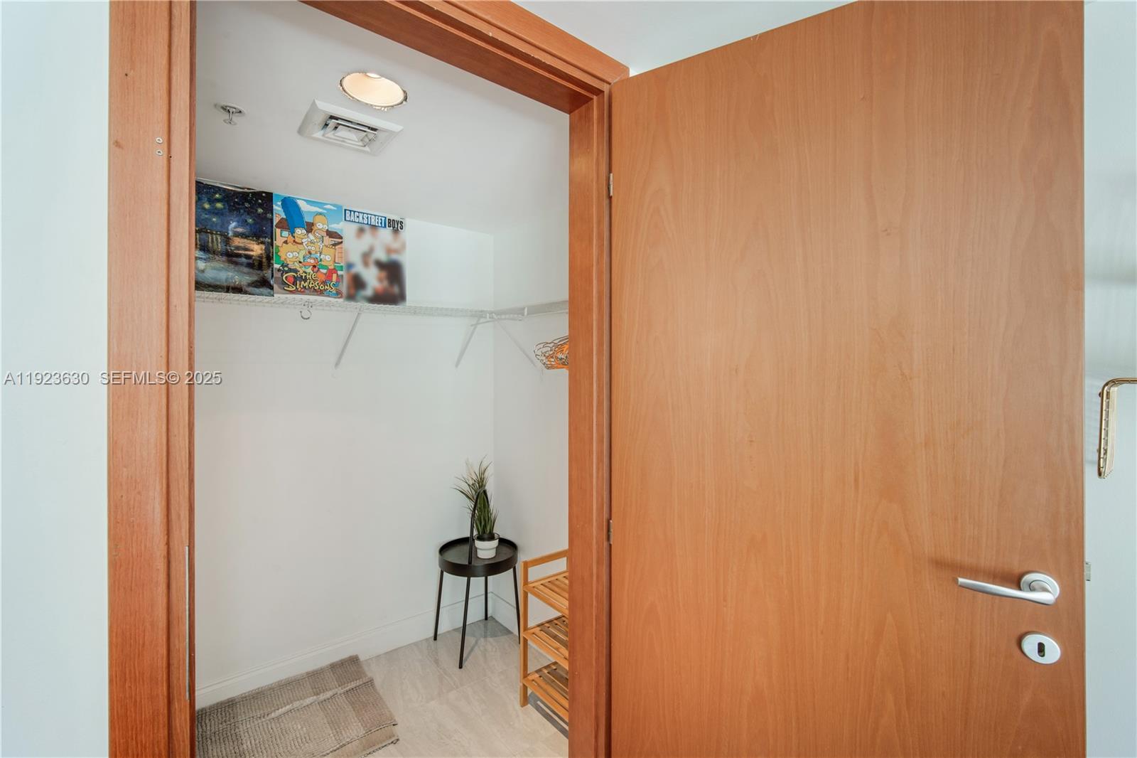 9499 Collins Avenue, Unit 1005 Surfside, FL 33154 - Photo 20 of 35 a bathroom with a shower and a table