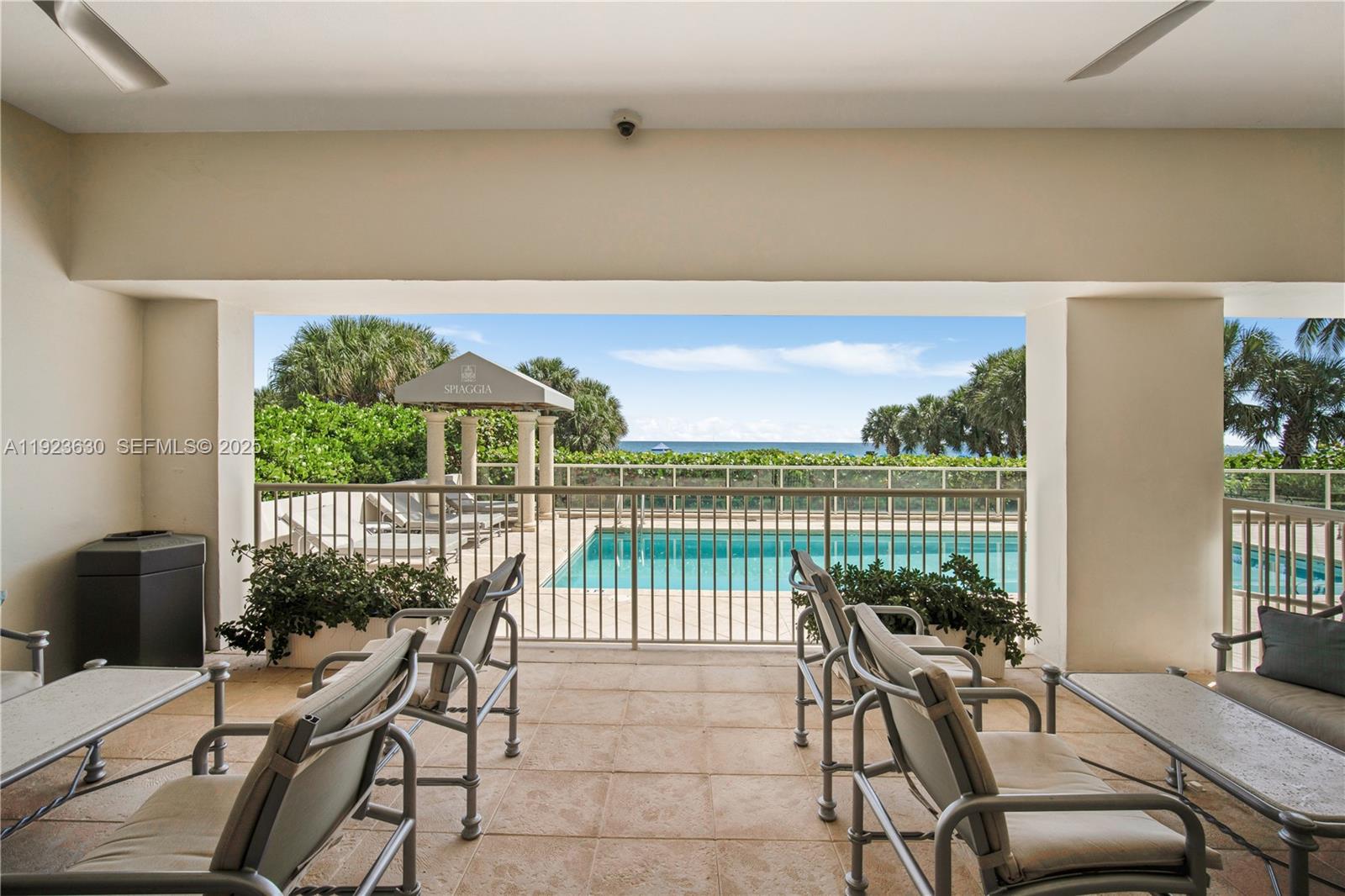 9499 Collins Avenue, Unit 1005 Surfside, FL 33154 - Photo 22 of 35 a balcony with furniture and garden view
