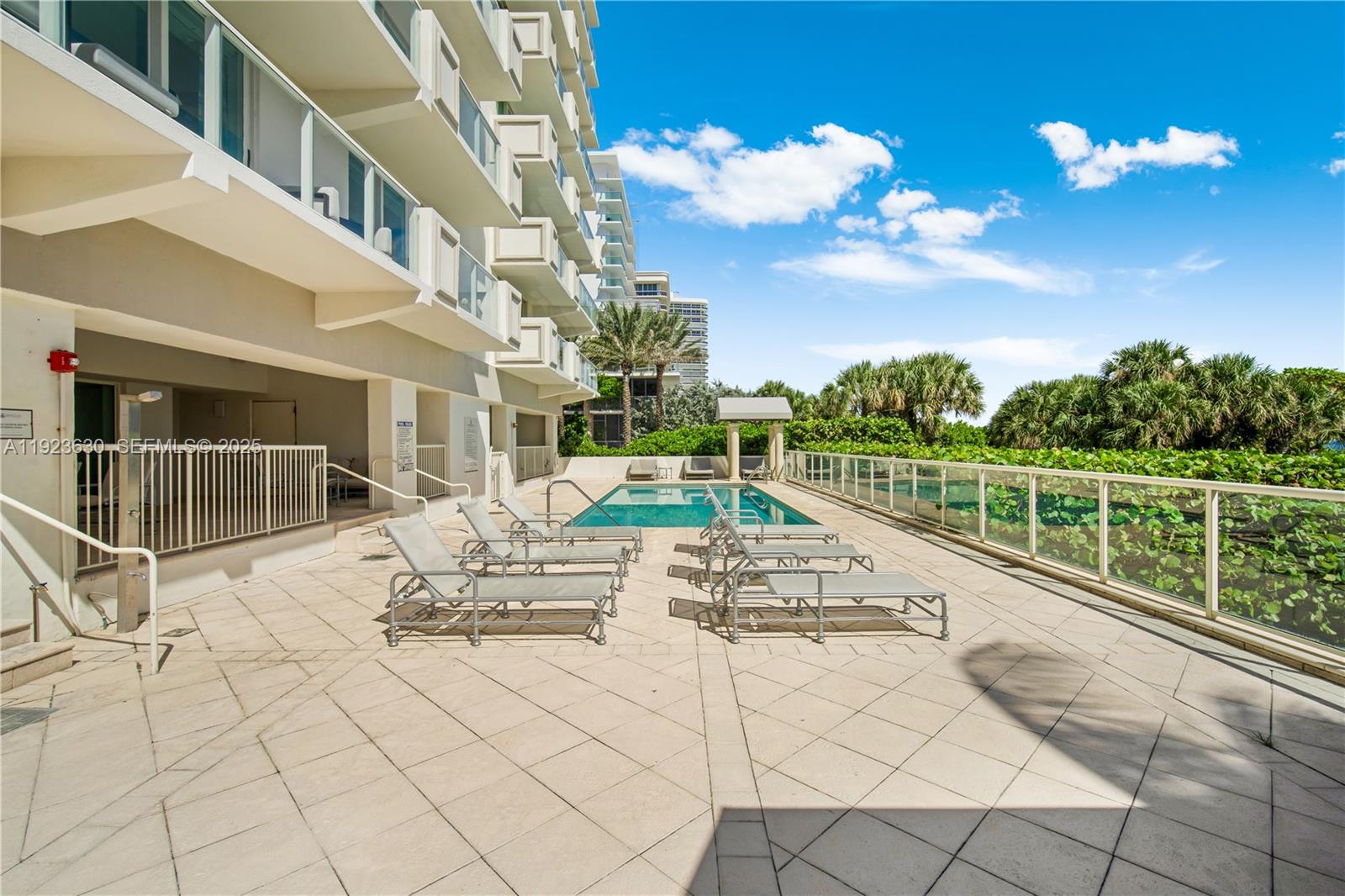 9499 Collins Avenue, Unit 1005 Surfside, FL 33154 - Photo 24 of 35 a view of a terrace with chairs