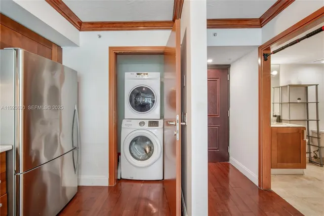 a view of washer and dryer with wooden floor