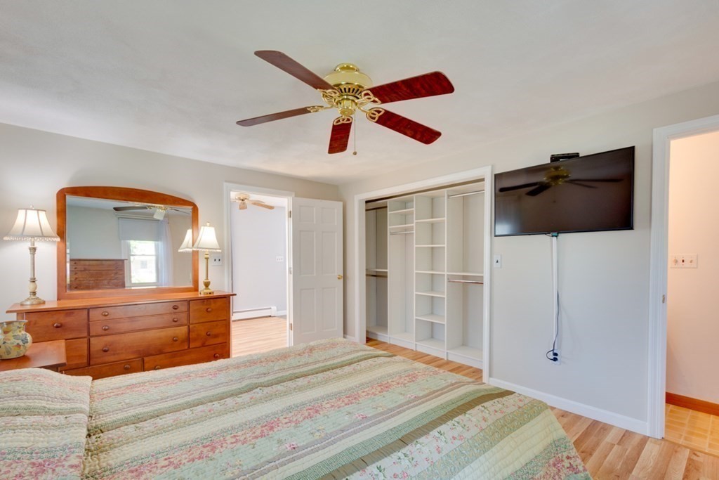 29 Anna Road Woburn, MA 01801 - Photo 12 of 29 a bedroom with a bed and a chandelier