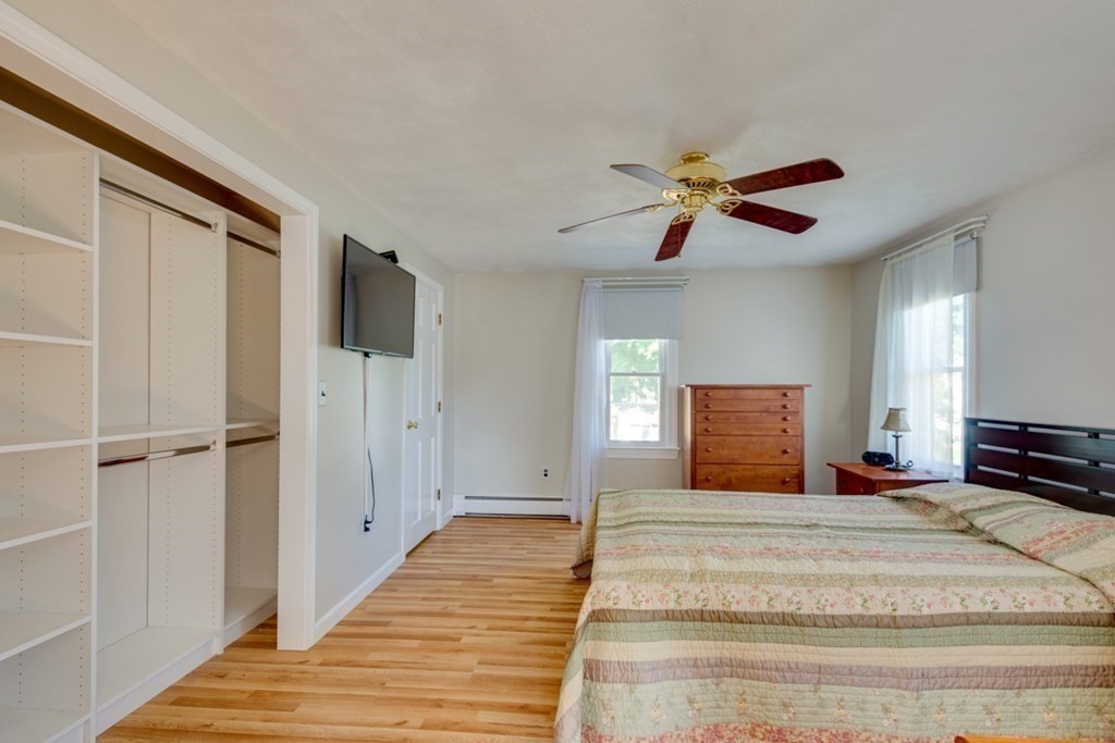 29 Anna Road Woburn, MA 01801 - Photo 13 of 29 a view of a bedroom with a bed and a chandelier