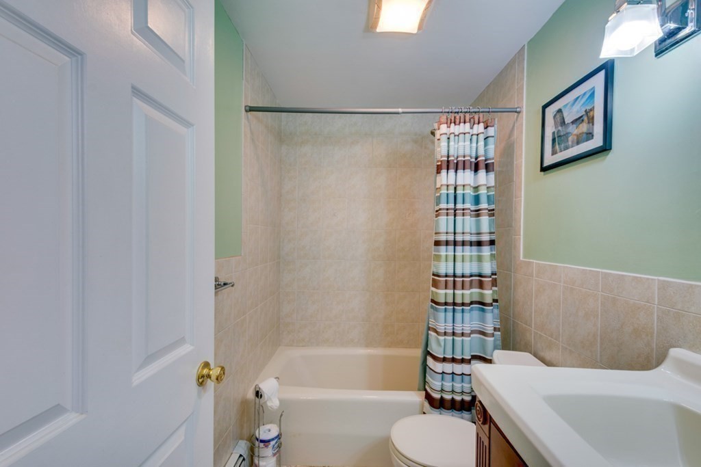 29 Anna Road Woburn, MA 01801 - Photo 20 of 29 a bathroom with a sink toilet and shower