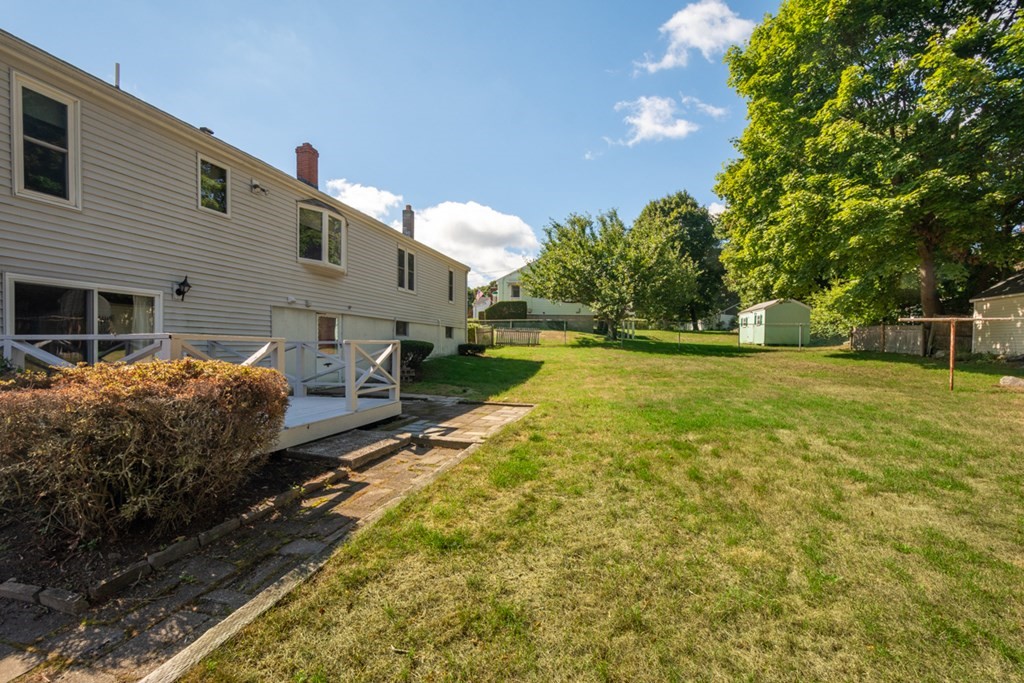 29 Anna Road Woburn, MA 01801 - Photo 24 of 29 a view of a house with backyard and sitting area