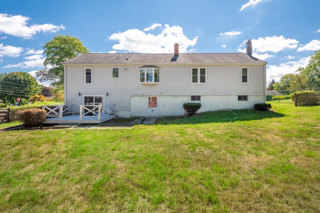 29 Anna Road Woburn, MA 01801 - Photo 25 of 29 a view of a house with backyard and sitting area