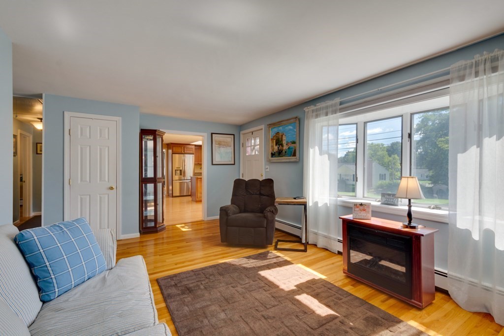 29 Anna Road Woburn, MA 01801 - Photo 8 of 29 a living room with furniture and a table