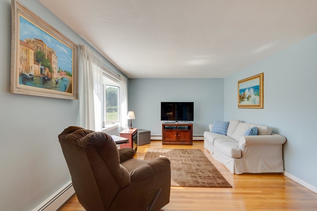 29 Anna Road Woburn, MA 01801 - Photo 10 of 29 a living room with furniture and a flat screen tv